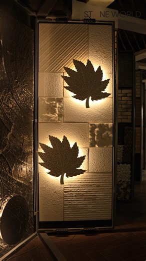 Stone World on Instagram: "New installation from Stone World. CNC-carved leaf motif on natural stone cladding with subtle back lighting. A modular feature wall design that fits double-height spaces, stair walls, foyers, and lounges."