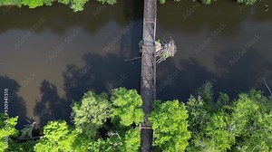 Springtown Railway Bridge over River in Springtown, New York Wallkill Valley Rail Trail (Paltz trestle viaduct) aerial drone view steel beams bars wooden platform from above trees scenic bike trail