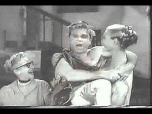 Tall woman lifts man