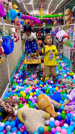 Standing on a slide the boy throwing a big ball in doll ball pool ride exciting #funny #shortvideo