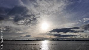 Fawley, Hampshire, England, United Kingdom. 05. 04. 2024. Sun going down over the Fawley gas and oil terminal view across Southampton Water, southern England, UK.