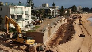 Concrete seawall designed to stop erosion could wipe out beach