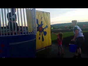 Violet dunks the lady in the dunk tank