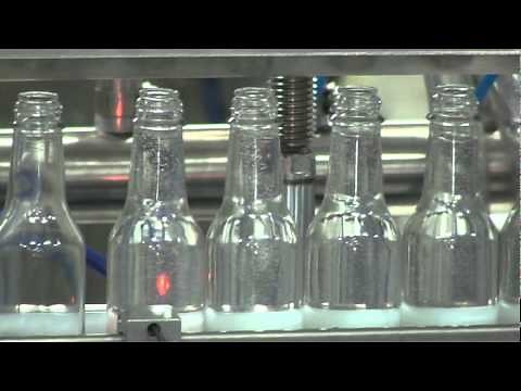 Pressure Overflow filler, working with Glass Bottles, by Acasi Machinery