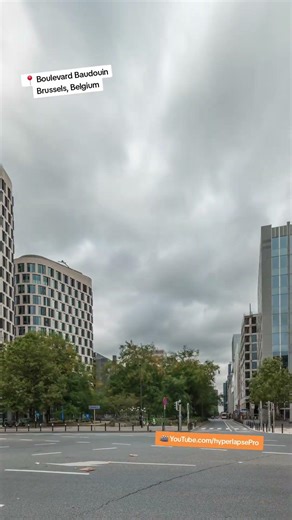 Timelapse panorama of modern buildings in business district on Boulevard Baudouin, Brussels, Belgium