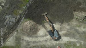 Excavator during clay mining. mining in open pit. Aerial view of an opencast for the extraction of clay and limestone. Brick and Tile.