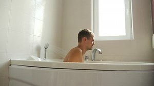 clip-32954104-man-taking-bath-4k-slow-motion