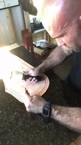 Stamping leather patterns creating texture and detail by hand