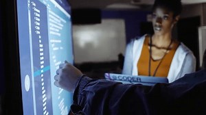 clip-3513963587-hackers-discussing-computer-code-during-hackathon