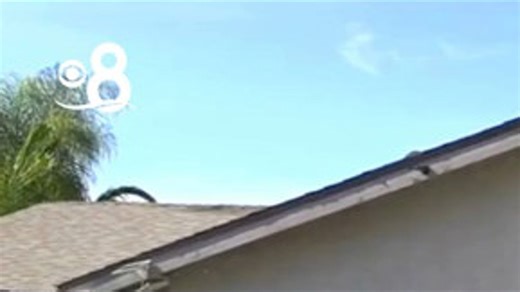 A driver allegedly texting crashed into a home in Santee around 11:30 a.m., sending debris inside and injuring one person. | CBS 8 San Diego