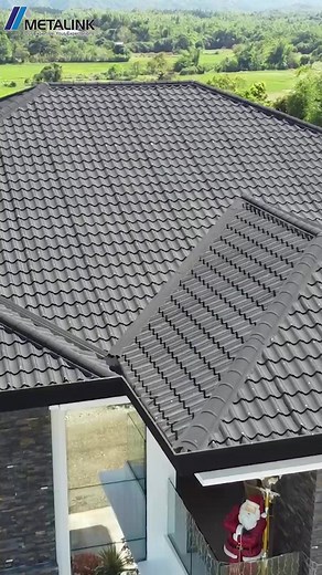 Metalink's STONETILE. The ideal choice for residential projects that seek a seamless connection with nature. This tile roof effortlessly blends with its lush green surroundings, creating harmony between aesthetic form and the natural environment. And because it’s eco-friendly, its alignment with nature goes beyond just design. #METALINKStrong #OriginalStoneCoatedLongSpan #Longspan #longspanstonecoated #tileype #roofing#roofingcontractor #galvalume #stonecoatedroofing #metalroofing #housedesign #