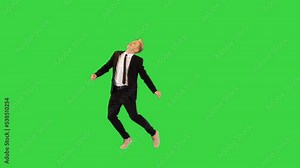Cool office worker walks in, dances, makes a spin and walks away on a Green Screen, Chroma Key.