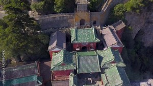 Aerial panorama to the highest peak of Wudang Mountain. Jindian Peak is the most famous scenic spot in Wudang Mountain. Very beautiful and magnificent scenery. Hubei province, China.