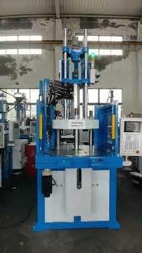 Rotary table vertical injection molding machine