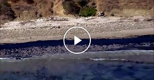 Broken pipeline spilling oil into ocean along central California coast