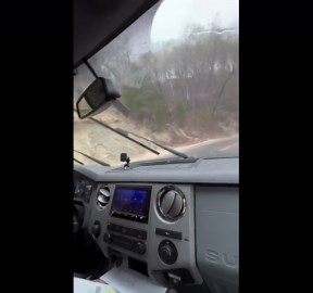 Water rushes down road after heavy rain in Madison, Indiana, USA