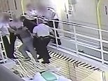 Shocking CCTV shows armed prisoner brawling with staff