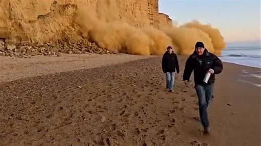 Beachgoers run in fear after rockfall at Dorset cliff