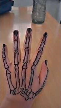 skeleton hand tattoo on hand with pen #art #tattoo #skeleton #penart #blackpen