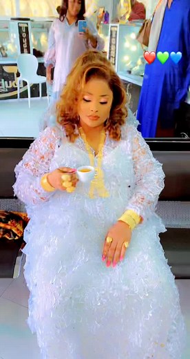 Elegant Tea Party Attire: White Lace Gown and Jewelry