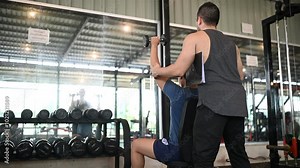 A Personal Trainer Guiding a Client through a Fitness Routine in a Gym - Emphasizing Health, Strength, and Wellness in a Supportive Environment