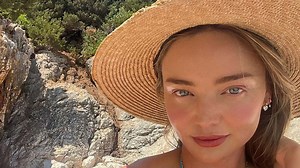 Miranda Kerr stuns in string bikini as she hits the beach following $120million home purchase