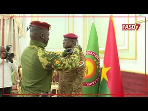 Major General Célestin Simporé receives his insignia from Captain Ibrahim Traoré