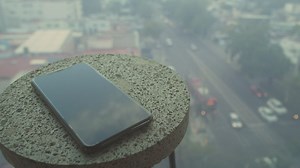 Phone on round end table - Free Stock Video