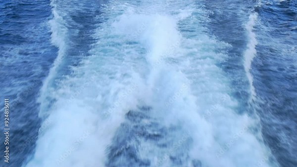 Dynamic waves created by moving boat, illustrating power and beauty of ocean. Feel the energy and rhythm of sea as boat carves through water, leaving mesmerizing patterns in its wake.
