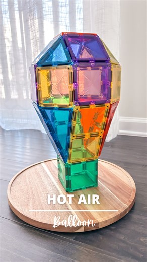 Alice | Magnetic Tiles Play Ideas on Instagram: "Comment “balloon” for build info! 🎈 Up, up, and away! Build your own magnetic tile hot air balloon and let your imagination soar! Instead of laying all the pieces on the floor and propping it up (which I found tricky), I built it this way—much easier! This is just one of the many fun builds from my new book, 50 Ultimate Magnetic Tile Builds for Kids—packed with creative ideas to spark endless play! I first saw this idea from @mobiusplayroom—thank