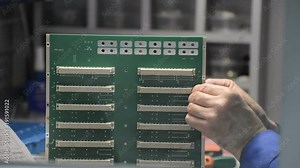 Manual installation and screwing of connectors to the PCB.