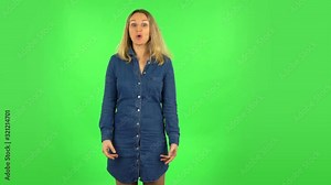 Very surprised fair woman with shocked wow face expression. Green screen