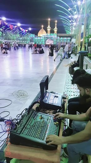 Sound Mixing Console Setup at Outdoor Cultural Event