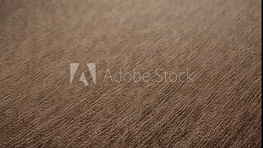 Brown fabric texture with tightly woven threads creating a pattern of vertical lines, suitable for backgrounds and design projects