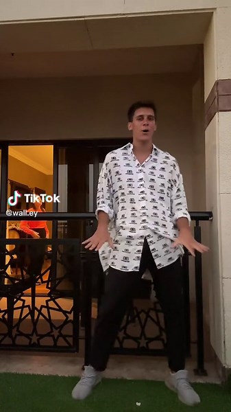 Balcony Dance Moves: Stylish Performance on a Bright Day