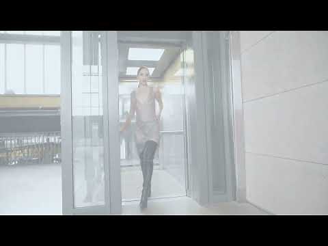 Daria in thigh-high Fernando Berlin leather boots and chain dress