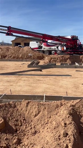Pouring Concrete Footings with Our Slinger Trailer
