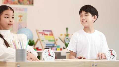 clip-3977901583-boy-girl-celebrate-success-high-five-bright