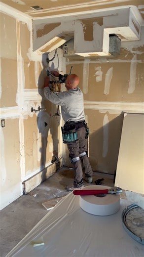 Sheet rocker fixing holes at work! Bob da builder