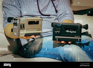 35-year-old Chinese videographer Mr. Gan shows world's first civil portable video camera Sony Handycam CCD-M8 he collected at home in Tianjin, China Stock Photo - Alamy