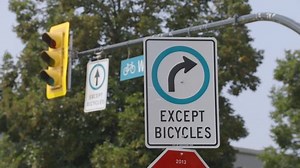 clip-1025295023-"right-turn-only-except-bicycles"-sign-above