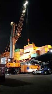 Loading operations at shipside as Crane Combines two containers