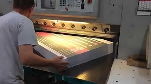 Measuring distance travelled on an axis of a large paper cutting machine