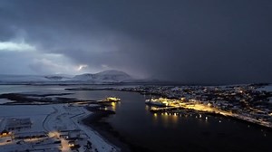 Sunset snow shower over Stromness Harbor, Orkney Islands, Scotland, UK