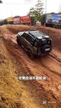 Range Rover Defender offroad in mud terrain