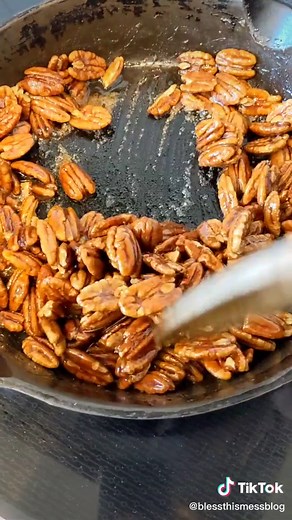 Candied Pecans are simple and made with just two ingredients, pecans and maple syrup! You can have these delicious nuts out of the pan in 15 minutes. #candiedpecans #pecans #easysnacks