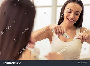 Portrait Beautiful Young Woman Applying Toothpaste Stock Photo 410381347 | Shutterstock
