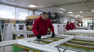 Install rubber sealant in plastic windows and doors. Manual worker assembling PVC doors and windows. Rubber gasket in plastic windows. Rubber Insulation for windows and doors.