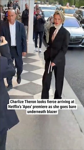 Charlize Theron looks fierce arriving at 'Apex' premiere as she goes bare underneath blazer