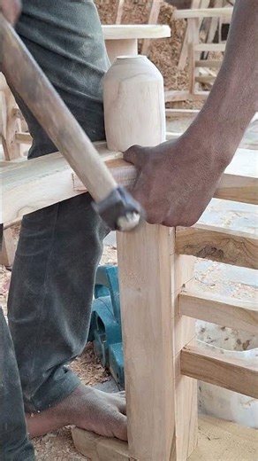 male carpenter nail install in Wood with the help of Hammer
